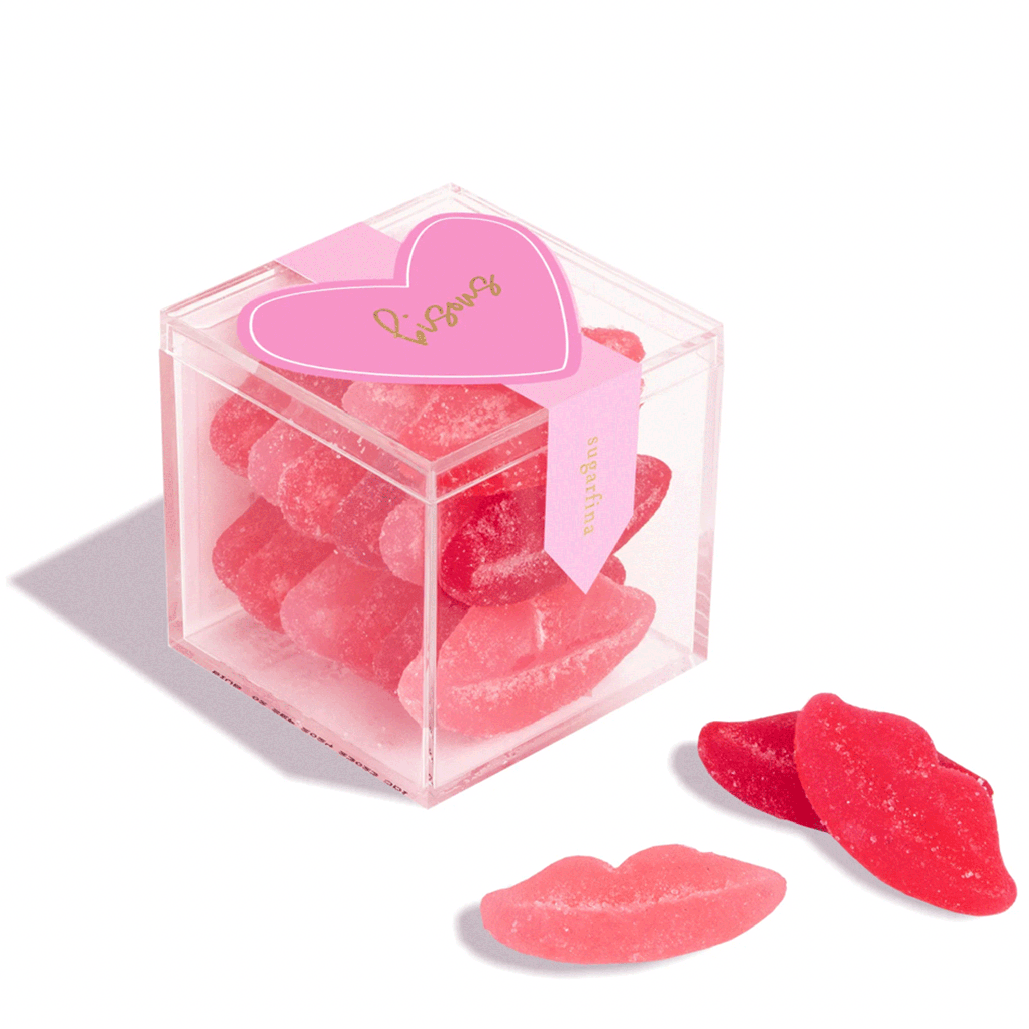 On a white background is a clear acrylic box filled with sugar lips gummy candies. 