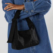 A black adjustable strap shoulder bag.