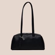 A black recycled leather handbag with shoulder straps.