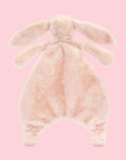 A blush pink bunny shaped furry unstuffed blanket/ toy.