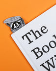 A raccoon in a trashcan shaped bookmark.