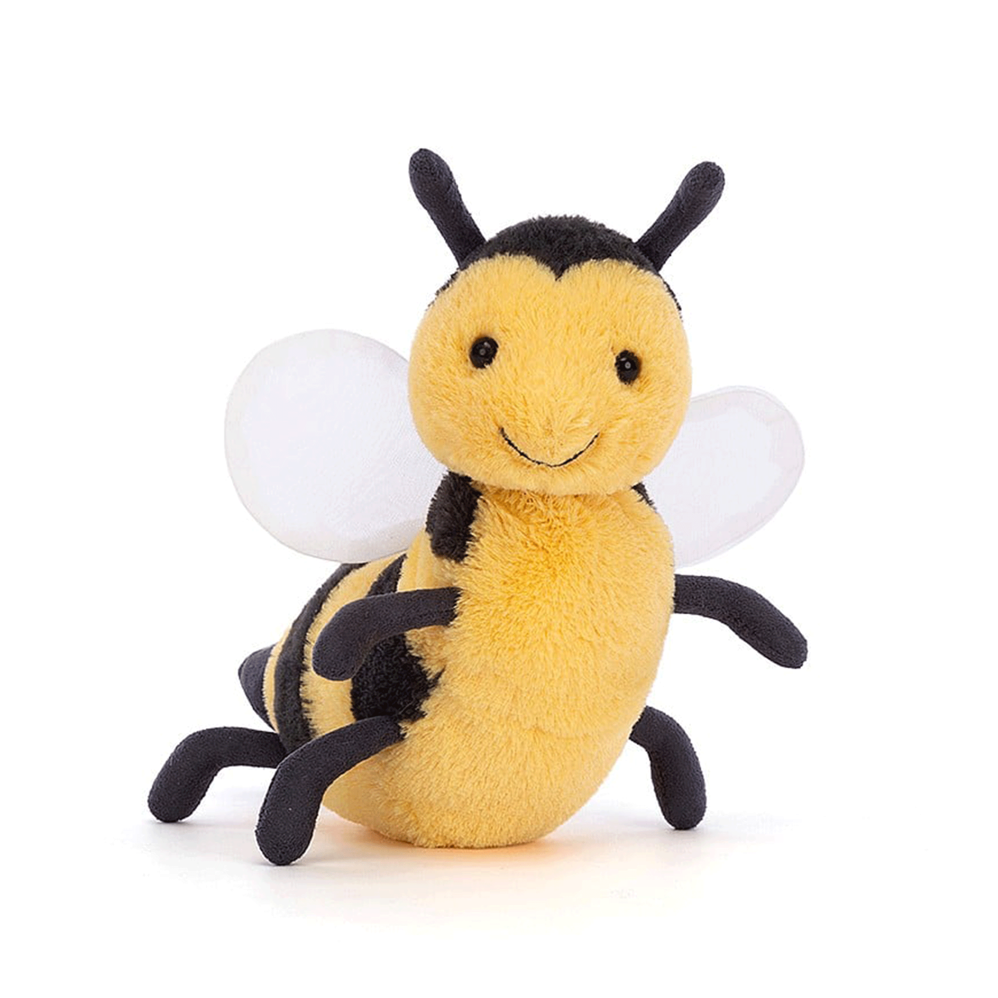On a white background is a yellow and black bee stuffed animal with a smiling face,  a fuzzy body and round wings. 