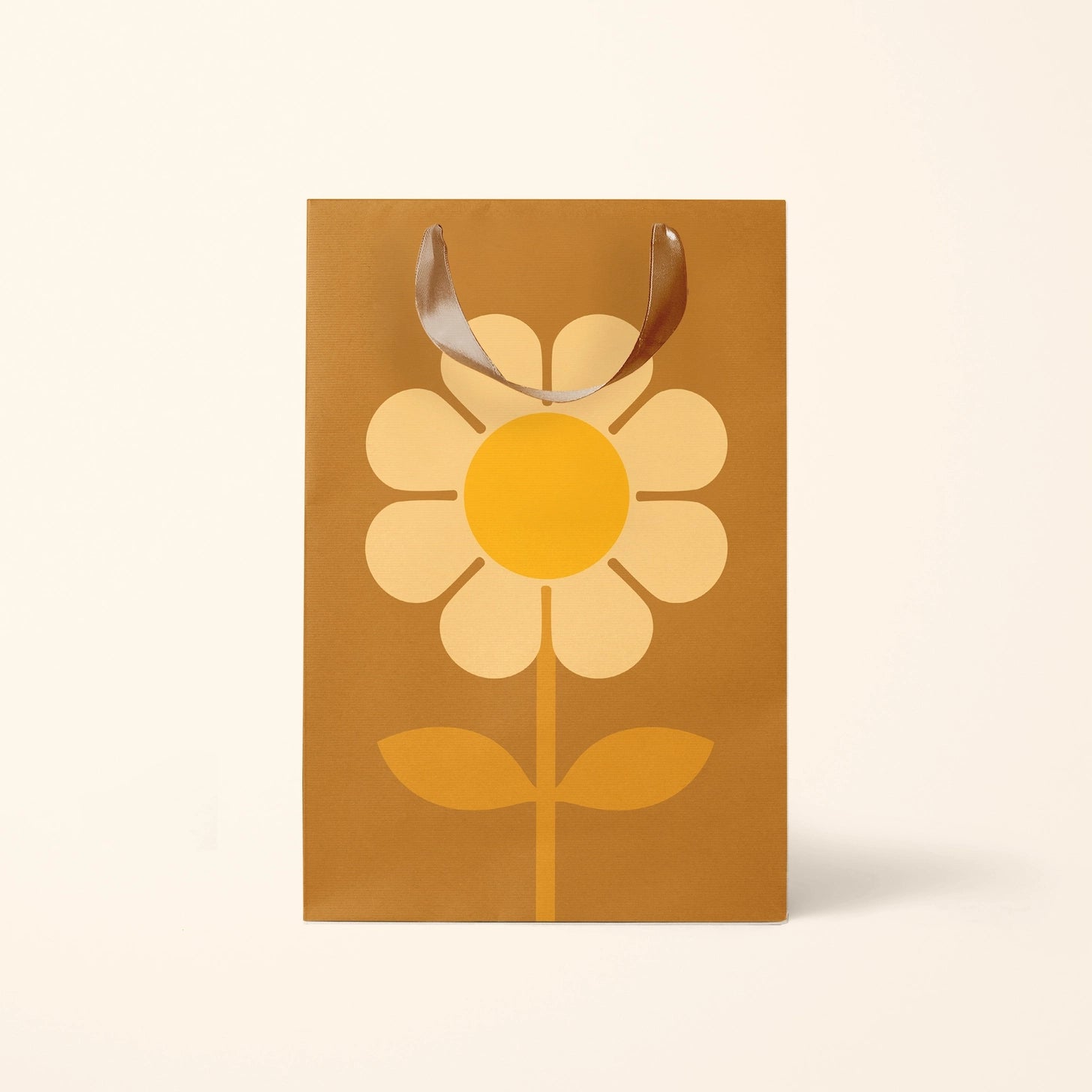 On a white background is a brown gift bag with a large yellow daisy in the center.