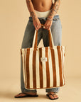 A brown and ivory terry cloth tote bag.