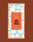 A caramel apple shaped chocolate bar with a ghost graphic packaging.