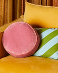 A round pink pillow.