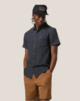 A washed black short sleeve button up shirt.
