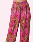 A pink cheetah print satin pajama pant.