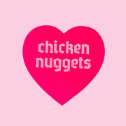 A pink heart sticker that reads, "chicken nuggets".