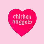 A pink heart sticker that reads, "chicken nuggets".