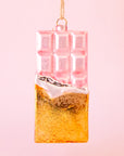 A light pink and gold chocolate bar shaped ornament.