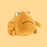 A yellow crab shaped stuffed animal.