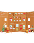 A candy advent calendar with multi colored roof and red door.