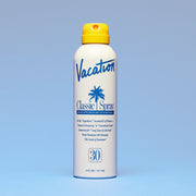 White glossy bottle of spray sunscreen. The bottle reads 'Vacation, Classic Spray, Broad Spectrum SPF 30 Sunscreen' in blue lettering. The bottle is complete with a yellow spray cap.