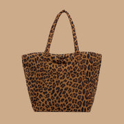 A leopard print puffer tote bag.