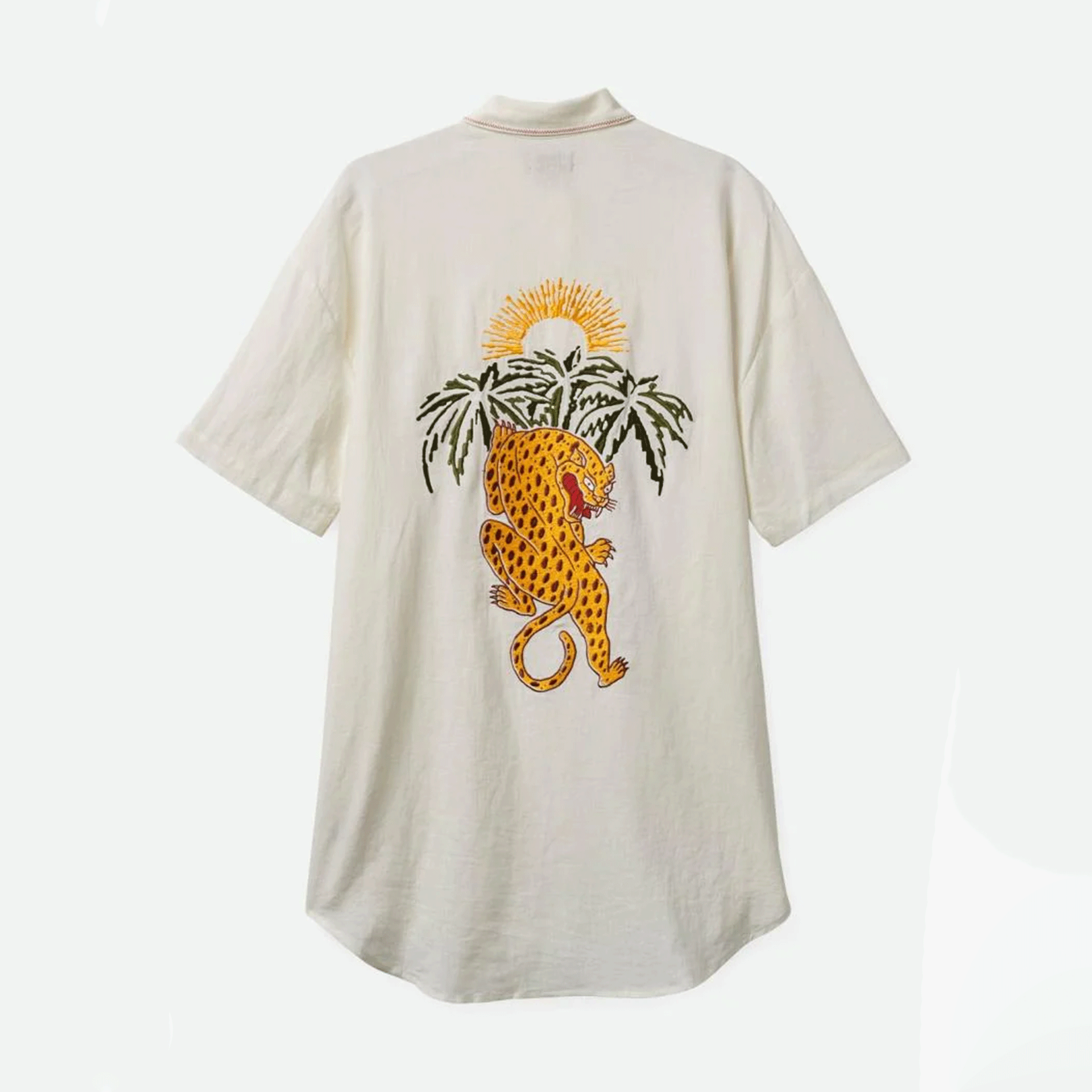 On a white background is a shirt dress with short sleeves and a jaguar and palm tree graphic on the back. 