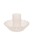 A cream glass taper candle holder with a wavy rim around the bottom.