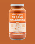 A glass jar of creamy calabrian marinara sauce.
