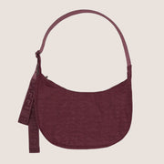 A mahogany colored nylon handbag with an adjustable strap.