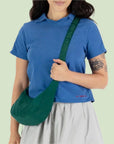 A green nylon shoulder / crossbody handbag with an adjustable strap.
