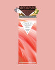 A dark chocolate bar with a coral pink feather graphic packaging.
