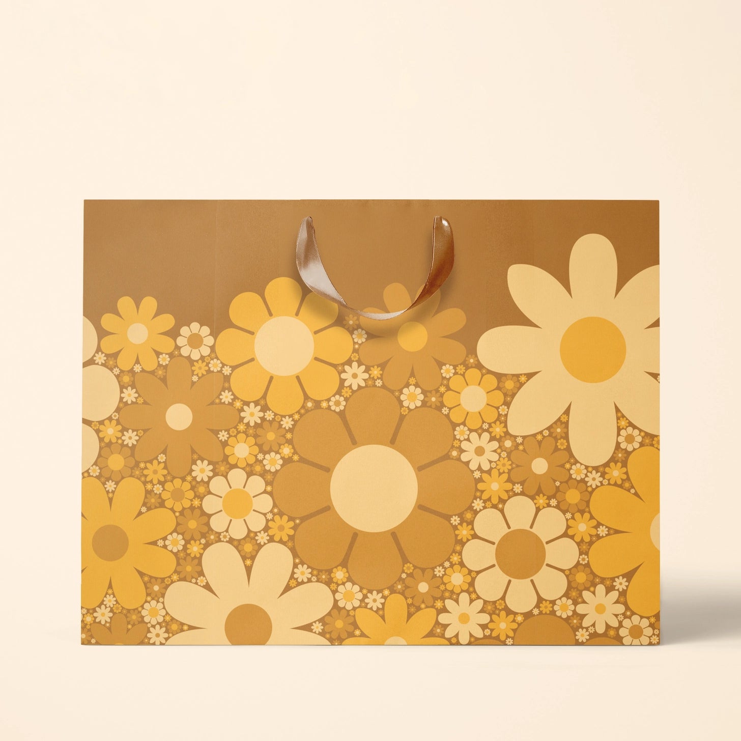On a white background is a brown gift bag with yellow daisies. 