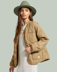 woman wearing light brown quilted jacket