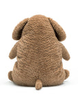 On a white background is a snuggly brown stuffed animal dog with sleepy eyes and a chunky figure.