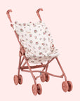 A rosey pink and ivory floral print doll stroller.