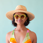 A round pair of light green sunglasses with a light brown lens.