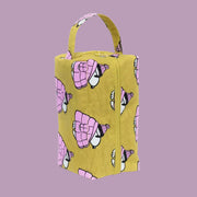 A chartreuse nylon dopp kit with a Snoopy print.