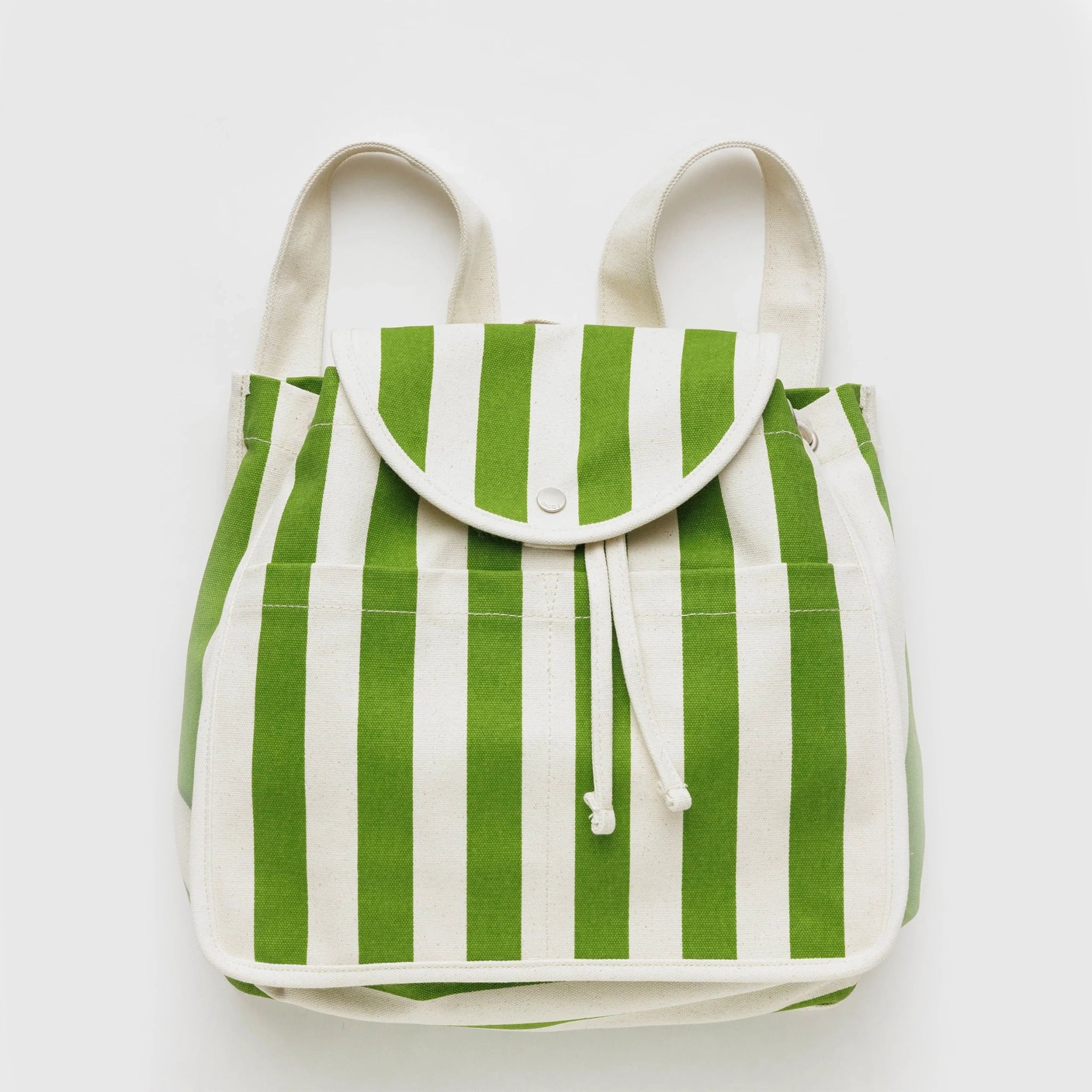 On a cream background is a green and white striped backpack with a folded flap and a drawstring opening along with two exterior pockets on the outside.