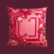 A pink floral print pillow.