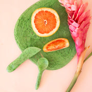 A resin green spreading knife.