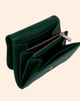 A dark green wallet with a removable crossbody strap.