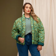 A green floral jacket with a dark green interior.