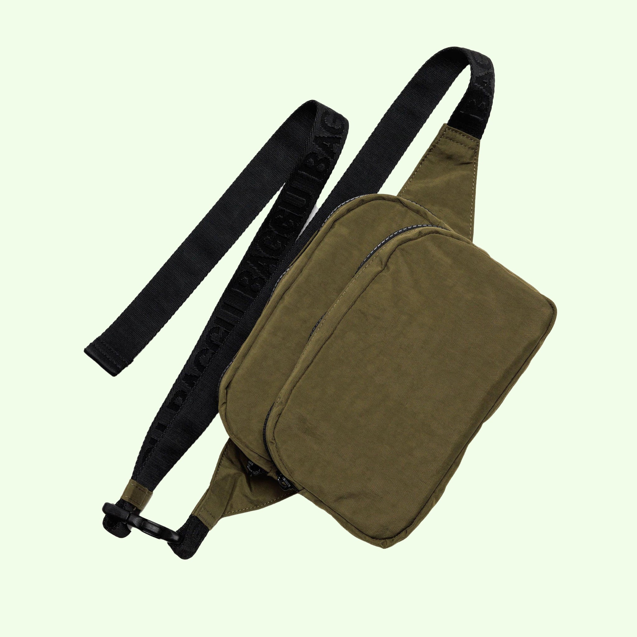 A dark green nylon fanny pack with two compartments and a black adjustable strap. 