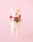 A felt mouse shaped ornament that is wearing a red backpack and holding a camera.