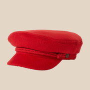 A red hat / cap with an interior label that reads, "Brixton".