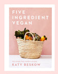 A salmon pink book cover with a neutral basket full of veggies along with a white border and white text that reads, "Five Ingredient Vegan'.