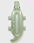 A light green crocodile shaped float.