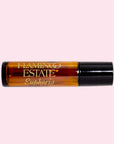 An amber roller ball fragrance oil with text that reads, 'Flamingo Estate Euphoria'.