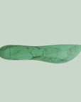 A resin green spreading knife.