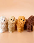 The different colors of the furry poodle ornaments available on our website.