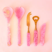 A fuchsia pink resin spreading knife perfect for dips cheese boards and more!