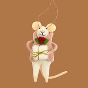 Mouse ornament with a pink coat on. She has a present in hand and has a holly berry on her coat.
