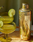 A gold cocktail shaker.