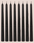 A set of black taper candles.