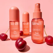 A small red bottle of cherry scented hair perfume.