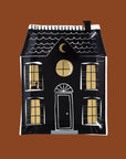 A black haunted house paper plate.